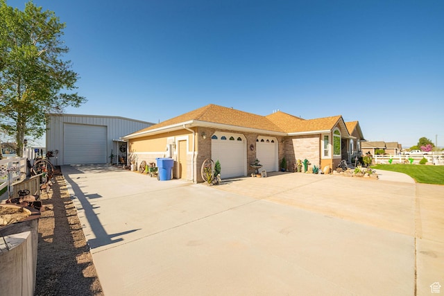 2983 W 2600 N, Plain City, UT 84404 - view of front of property with brick siding, a garage, a shingled roof, and concrete driveway