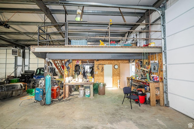 2983 W 2600 N, Plain City, UT 84404 - garage featuring electric panel and a workshop area