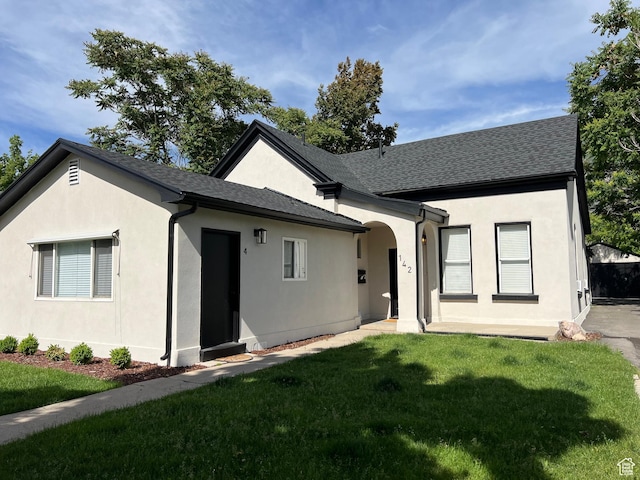 142 N 100 E, Provo, UT 84606 - ranch-style house featuring a front lawn, stucco siding, and a shingled roof