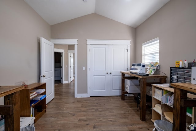 office space featuring vaulted ceiling and wood finished floors