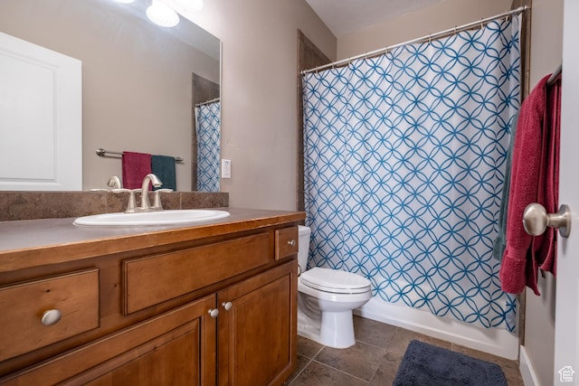 full bathroom with vanity, toilet, and tile patterned floors