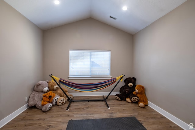 misc room featuring baseboards, recessed lighting, vaulted ceiling, and wood finished floors