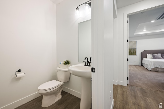 733 W Juniper Hill Dr, St George, UT 84790 - bathroom featuring a sink, baseboards, toilet, and wood finished floors
