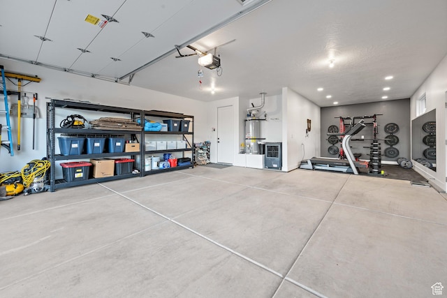 733 W Juniper Hill Dr, St George, UT 84790 - garage featuring recessed lighting, a garage door opener, and water heater