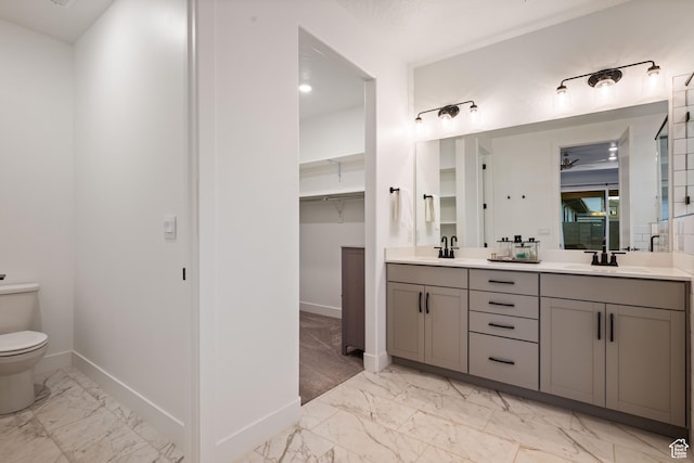 733 W Juniper Hill Dr, St George, UT 84790 - full bath with a sink, baseboards, toilet, and marble finish floor