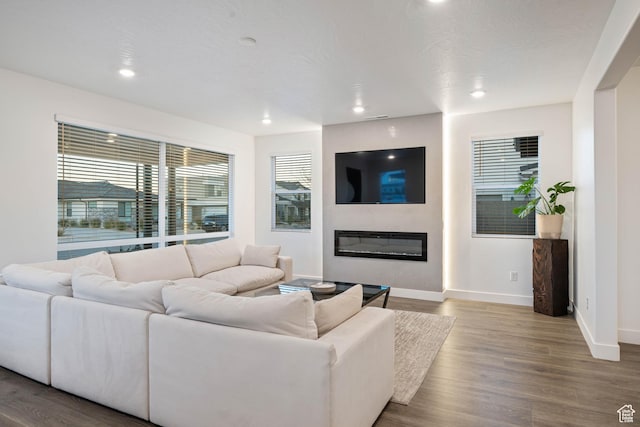 733 W Juniper Hill Dr, St George, UT 84790 - living room featuring baseboards, recessed lighting, a glass covered fireplace, and wood finished floors