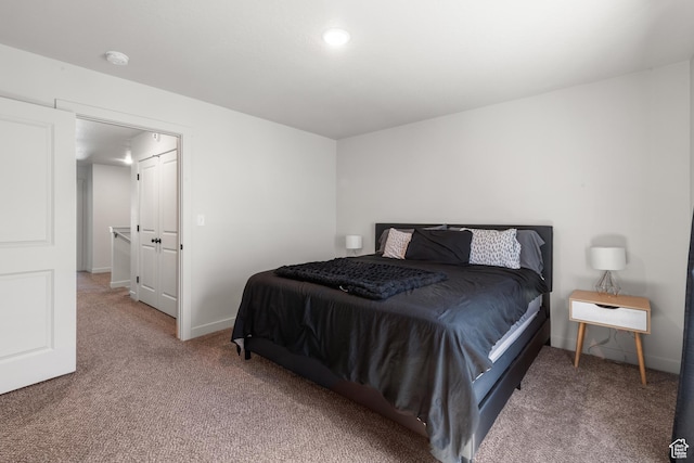 bedroom featuring carpet floors and baseboards