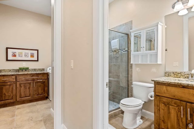 full bathroom featuring toilet, a shower stall, tile patterned flooring, and vanity