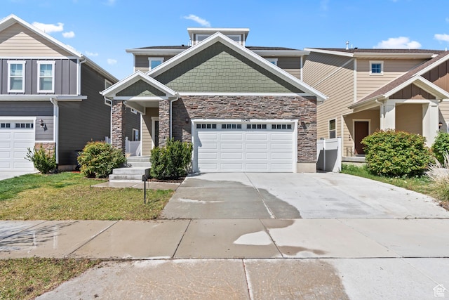 craftsman house featuring concrete driveway, an attached garage, stone siding, and a front lawn