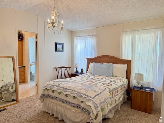 3149 S Prairie Dog Way, Garden City, UT 84028 - carpeted bedroom with an inviting chandelier, a textured ceiling, and lofted ceiling