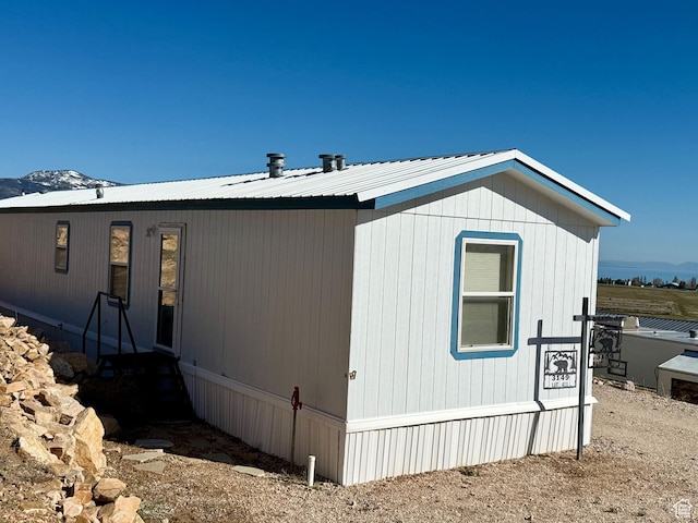 3149 S Prairie Dog Way, Garden City, UT 84028 - view of side of property featuring metal roof and a mountain view