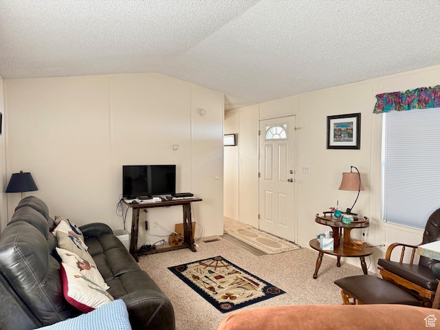 3149 S Prairie Dog Way, Garden City, UT 84028 - carpeted living area featuring a textured ceiling and vaulted ceiling
