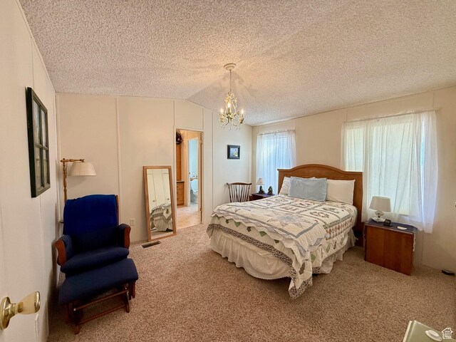3149 S Prairie Dog Way, Garden City, UT 84028 - carpeted bedroom featuring visible vents, a textured ceiling, a chandelier, and vaulted ceiling