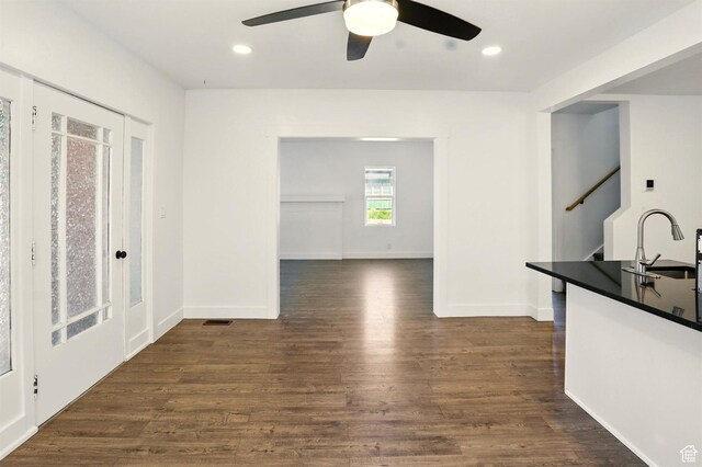868 Washington Blvd, Ogden, UT 84404 - interior space featuring a ceiling fan, a sink, baseboards, dark wood-style floors, and stairs