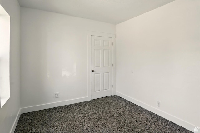 868 Washington Blvd, Ogden, UT 84404 - empty room featuring baseboards and dark carpet