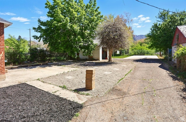 868 Washington Blvd, Ogden, UT 84404 - view of yard with a mountain view and fence