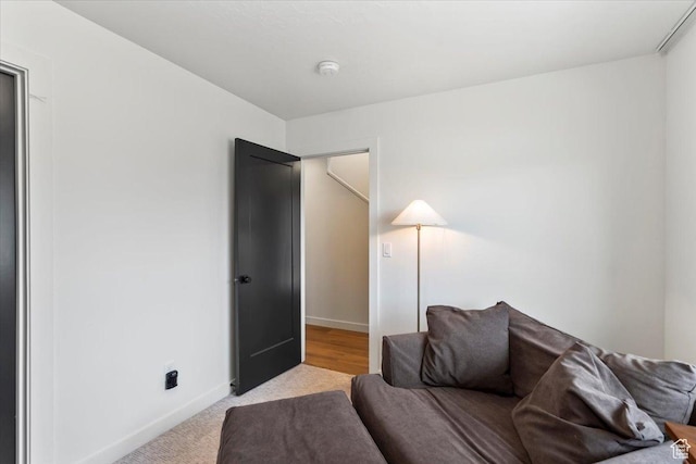 sitting room with carpet flooring and baseboards