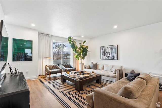 living room featuring recessed lighting and light wood-type flooring