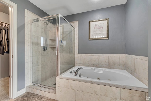 8983 N Barton Creek Dr, Eagle Mountain, UT 84005 - bathroom featuring a whirlpool tub, a walk in closet, and a stall shower