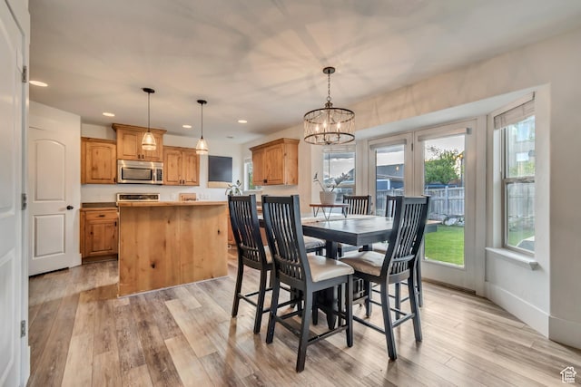 8983 N Barton Creek Dr, Eagle Mountain, UT 84005 - dining room featuring recessed lighting, a chandelier, and light wood-style flooring