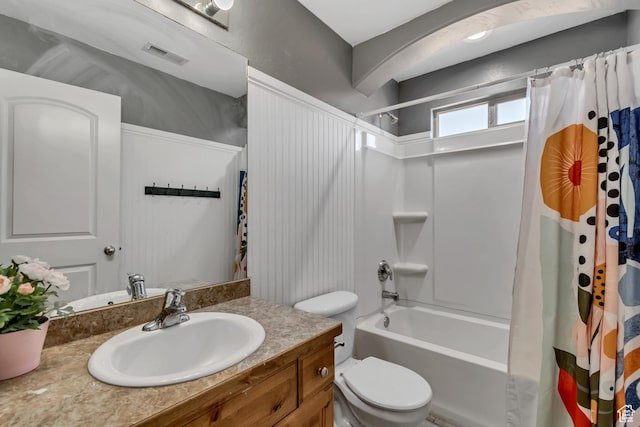 8983 N Barton Creek Dr, Eagle Mountain, UT 84005 - bathroom with toilet, visible vents, shower / bathtub combination with curtain, and vanity