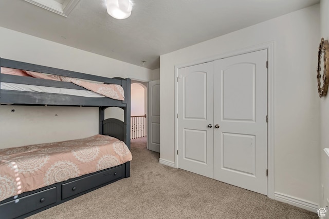 8983 N Barton Creek Dr, Eagle Mountain, UT 84005 - bedroom featuring baseboards, light carpet, and a closet