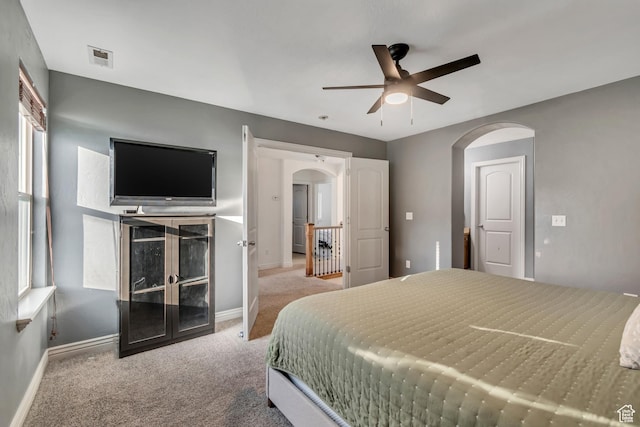 8983 N Barton Creek Dr, Eagle Mountain, UT 84005 - bedroom featuring arched walkways, baseboards, a ceiling fan, and carpet
