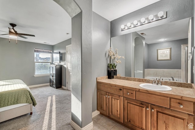 8983 N Barton Creek Dr, Eagle Mountain, UT 84005 - full bathroom featuring baseboards, ceiling fan, and vanity
