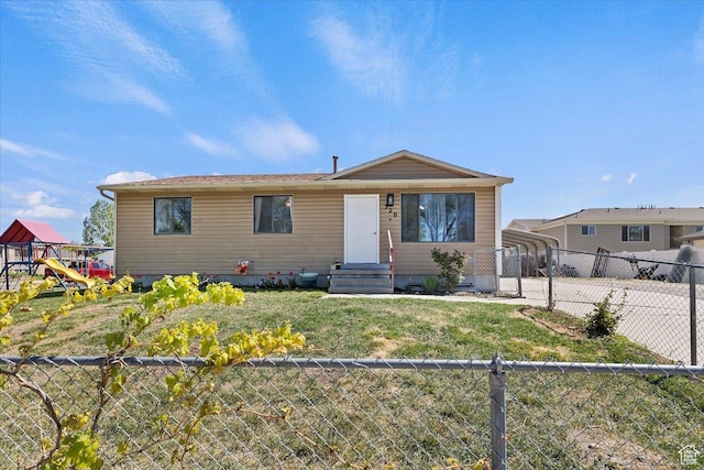 320 E Clark St, Grantsville, UT 84029 - bungalow with a fenced backyard, a detached carport, a playground, and a front lawn