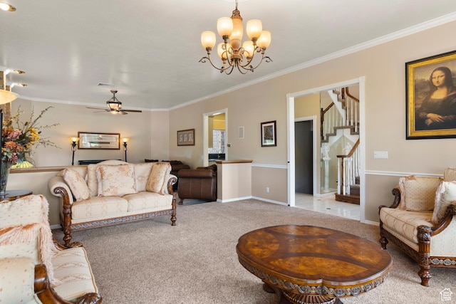 carpeted living room with crown molding, ceiling fan with notable chandelier, baseboards, visible vents, and stairway