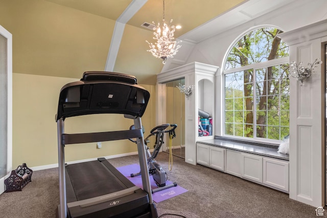 exercise area featuring visible vents, a healthy amount of sunlight, vaulted ceiling, and dark colored carpet