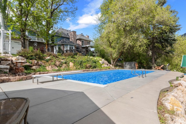 outdoor pool featuring a patio