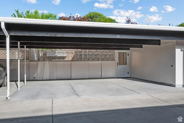 view of parking with fence