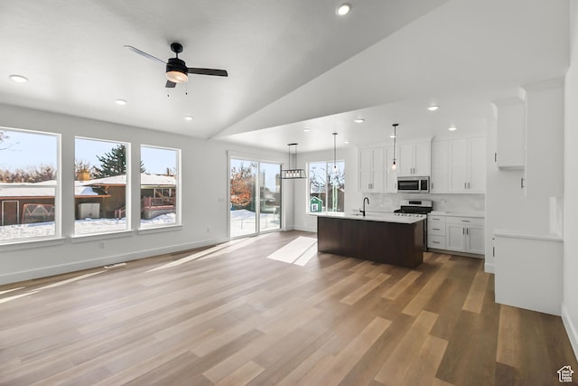 131 N 950 E Unit 35, Tremonton, UT 84337 - kitchen with recessed lighting, light countertops, white cabinets, a ceiling fan, and stainless steel appliances