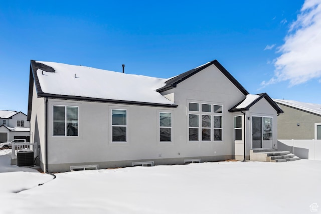 131 N 950 E Unit 35, Tremonton, UT 84337 - snow covered property featuring central AC, fence, and stucco siding