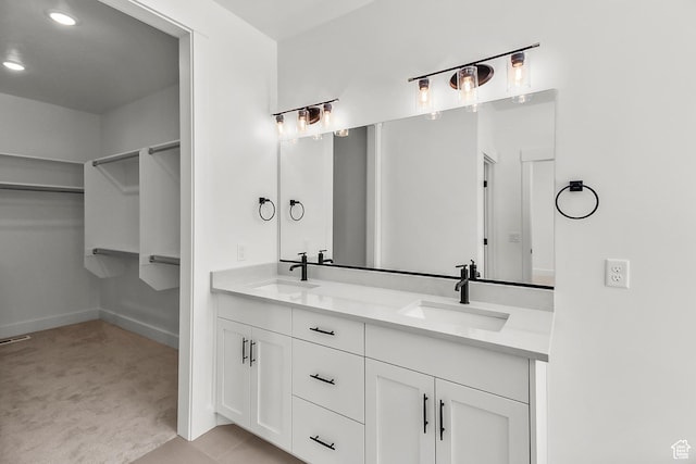 131 N 950 E Unit 35, Tremonton, UT 84337 - full bath featuring double vanity, a walk in closet, recessed lighting, and a sink