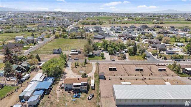 birds eye view of property with a residential view and a mountain view