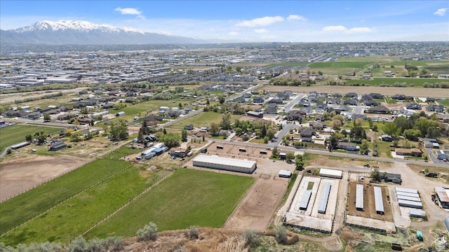 birds eye view of property with a mountain view