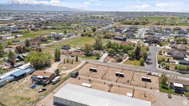 birds eye view of property with a mountain view and a residential view