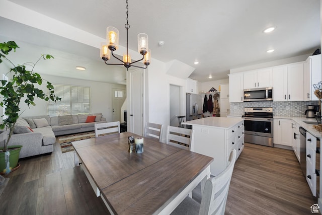 743 N 690 E, Tooele, UT 84074 - dining room featuring dark wood-type flooring, recessed lighting, and a chandelier