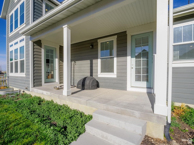 doorway to property featuring covered porch