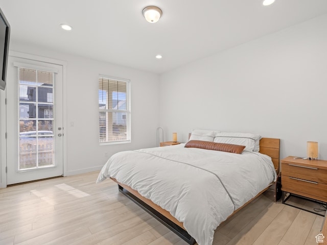 bedroom with recessed lighting, baseboards, access to exterior, and light wood finished floors
