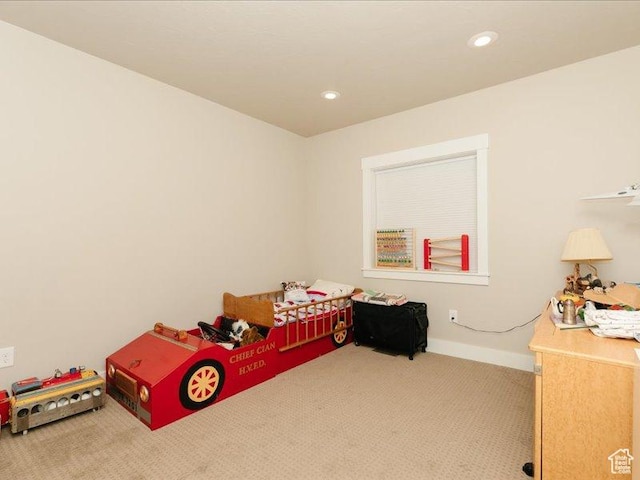 carpeted bedroom featuring recessed lighting and baseboards