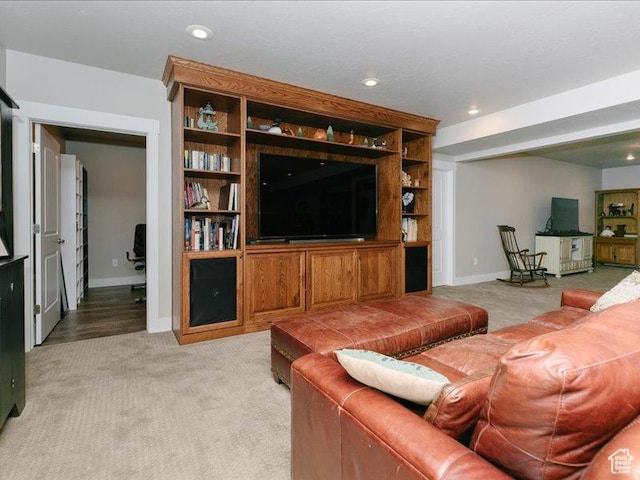 living room with recessed lighting, baseboards, and light colored carpet