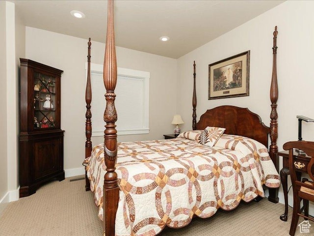 bedroom with recessed lighting, baseboards, and light carpet
