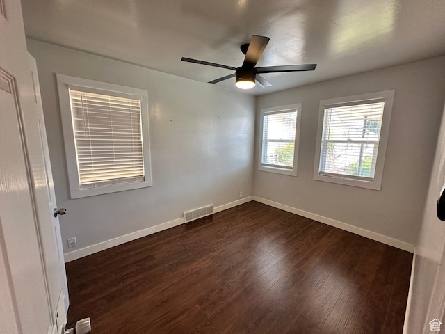 953 E 24th St, Ogden, UT 84401 - empty room featuring baseboards, dark wood finished floors, visible vents, and a ceiling fan