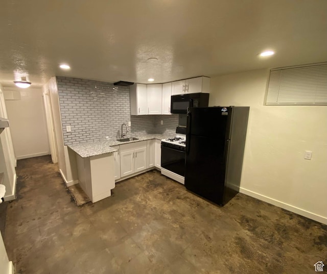 953 E 24th St, Ogden, UT 84401 - kitchen with a sink, black appliances, white cabinetry, light stone countertops, and baseboards