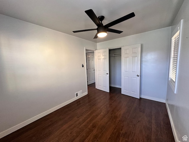953 E 24th St, Ogden, UT 84401 - unfurnished bedroom featuring a closet, dark wood-type flooring, baseboards, visible vents, and ceiling fan