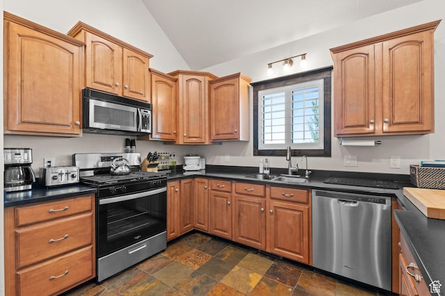 294 W Farmside Dr S, Saratoga Springs, UT 84045 - kitchen featuring stainless steel appliances, a sink, vaulted ceiling, dark countertops, and dark stone finish floors