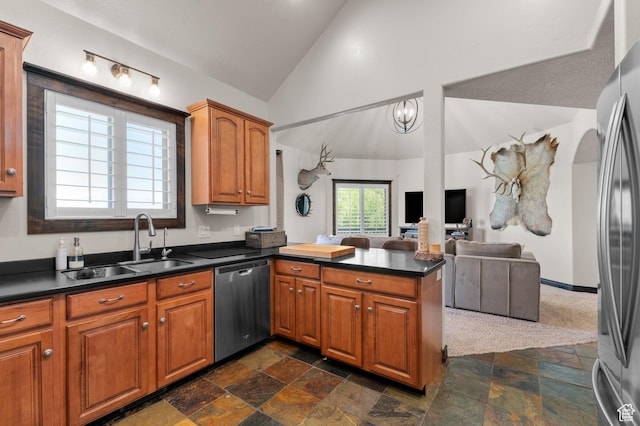 294 W Farmside Dr S, Saratoga Springs, UT 84045 - kitchen featuring appliances with stainless steel finishes, a sink, dark countertops, a peninsula, and brown cabinetry